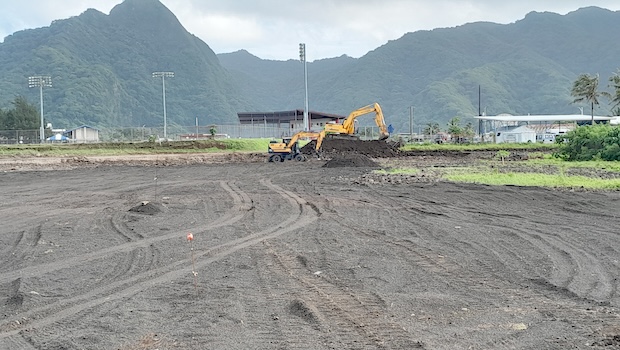 Heavy duty machinery leveling building site