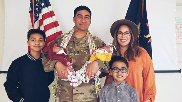 Infantry Drill Sergeant Mumaina Lagai with his wife and children