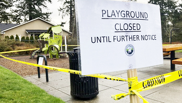 Police caution tape surrounds a playground in Lake Oswego, Ore.