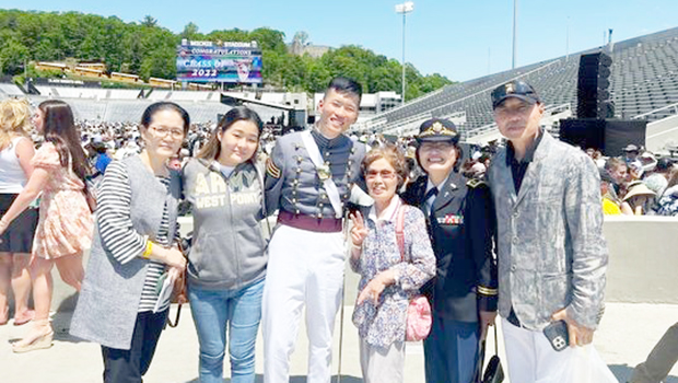 Graduate Cadet Seung Ju Myung with his family and supporters