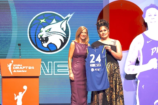 Utah’s Alissa Pili, right, poses for a photo with WNBA commissioner Cathy Engelber
