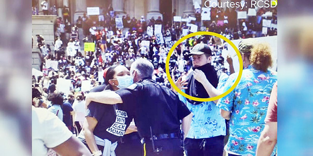 Two protestors wearing Aloha Shirts