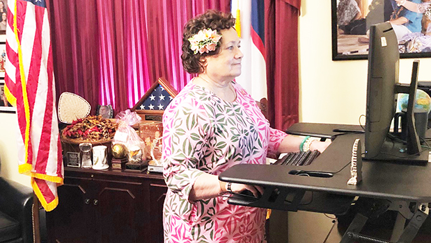 Congresswoman Uifa’atali Amata at desk
