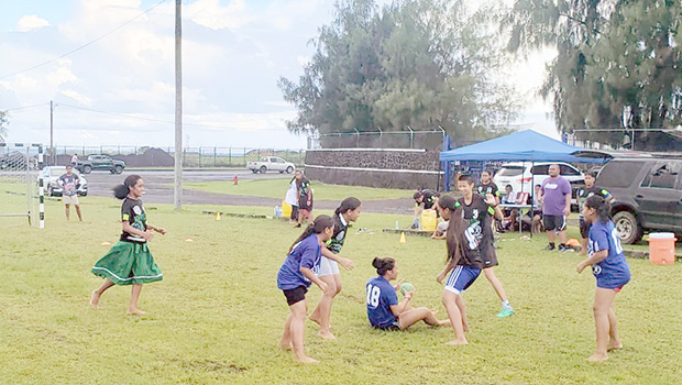 Amelie Chen of The Wolves fights for a loose ball 