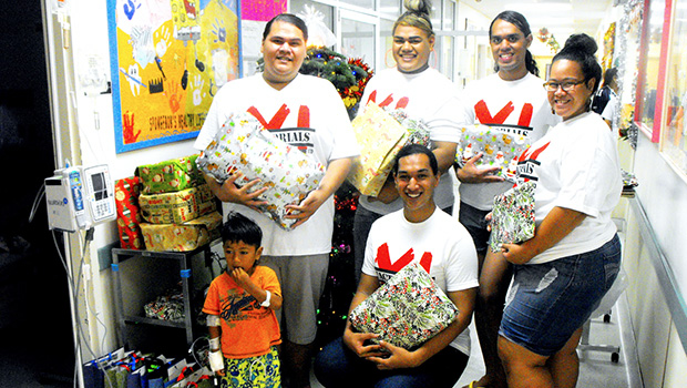 Members of the American Samoa Community College student club X-Factorials visit the LBJ Hospital Pediatric Ward to share some Christmas cheer