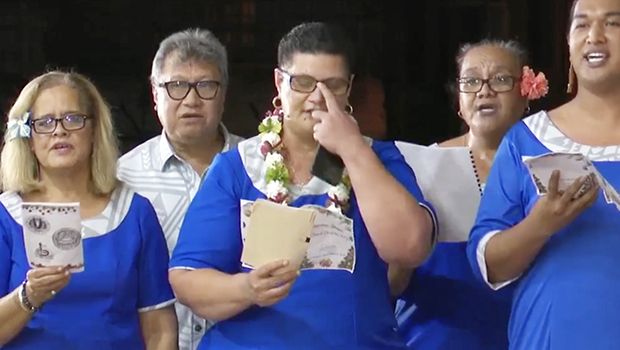 ASCC staff performing at caroling event