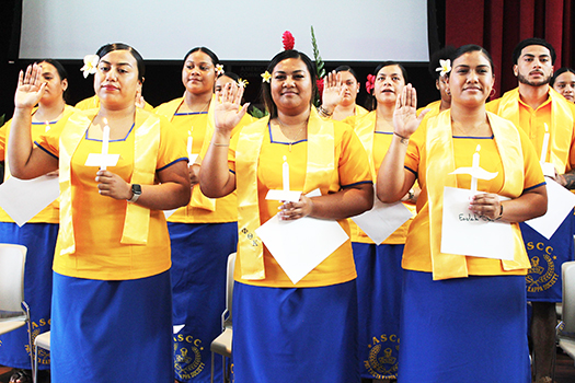 ASCC STUDENTS being inducted into the Phi Theta Kappa Honor Society prepare