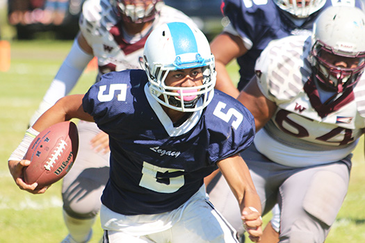 Fitu Amata Jr. of Samoana carrying the ball