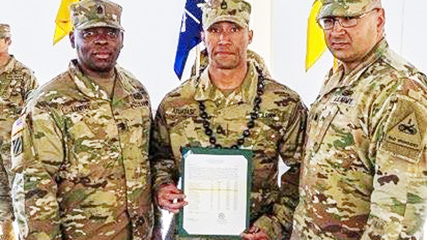 Alexander Francis Atuatasi (center)