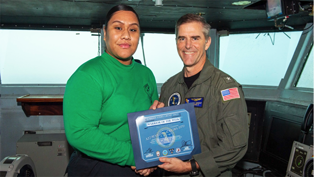 Petty Officer AZ 2nd Class Penelope Alailima-Utu and Rear Admiral M.J. Miquez