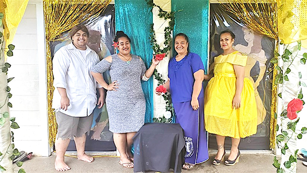 Team #3, standing proudly in front of their Beauty and the Beast door. At far right is a staff member dressed as Belle, the main character in the Disney blockbuster. 