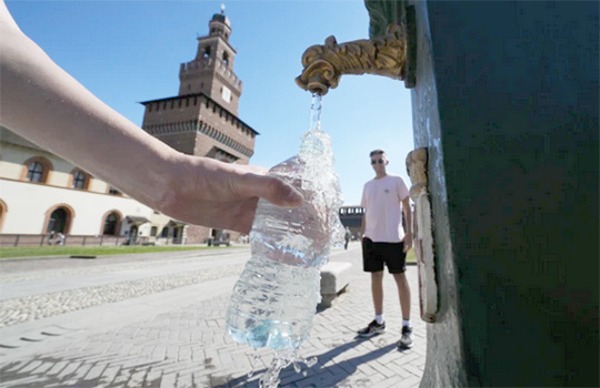 filling a plastic water bottle