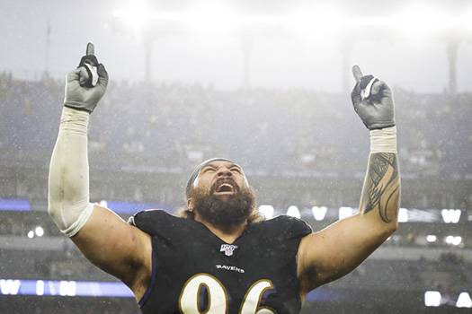 Domata Peko celebrates