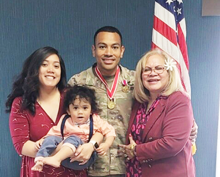 Capt. Paunga with his wife, mother and son