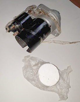 A car part and the baggie of cocaine found in it