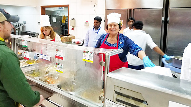 Amata serving food to the troops in Kuwait over the Christmas holiday