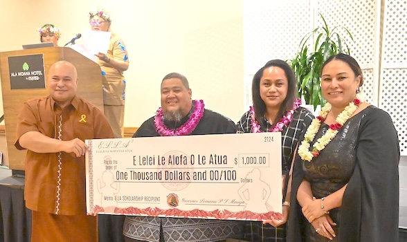 Chief of Staff Loa Tuimavave T. Laupola presents check 