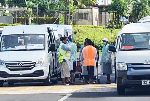 Health Dept. personnel outside area where Church Minister and his wife are quarantined. 