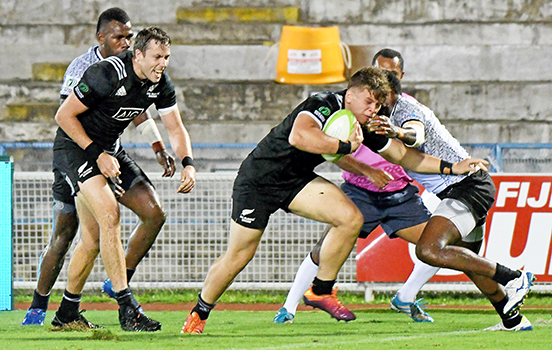 Tim Mikkelson, cheers on young Niko Jones