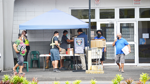 People lined up at customs check point at USPS