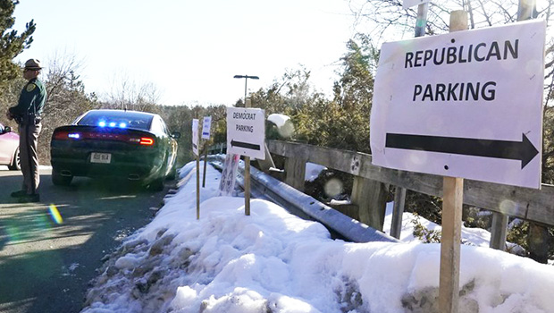 Parking lot with signs saying Republican parking and Democrat parking