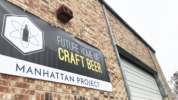 Photo of The Manhattan Project Beer Company building and sign