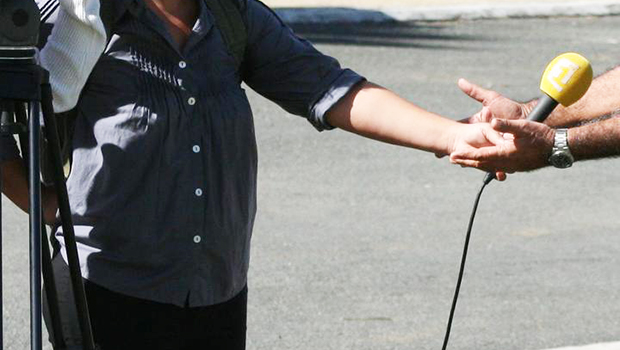 Reporter with a microphone.