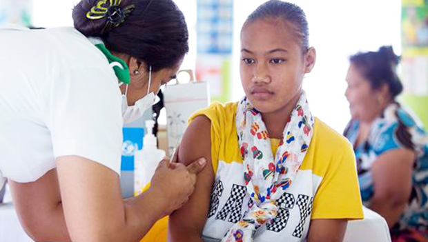 Samoan girl receiving a vaccine