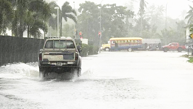 A flooded road in Samoa's Pesega