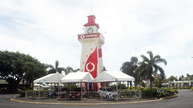 Clock tower in Apia, Samoa painted with Vodafone  logo 