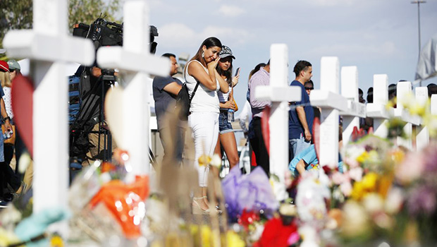 People visit a makeshift memorial in El Paso, Texas