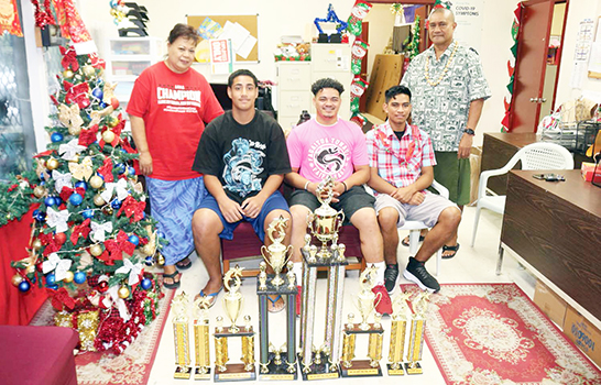 (L-R sitting) Best Defensive Player George Tuiolemotu (SHS), Coach of the Year from Faga’itua High School, and Season MVP Lisi Ianuari (FHS)