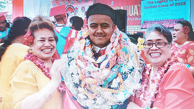 Toamalama Filiki Toelupe with others at FHS graduation