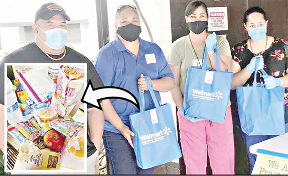 Volunteers packaging up food and supplies for stranded residents.