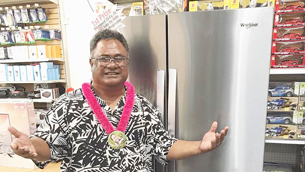 Talavave Maae with the Whirlpool refrigerator he won.