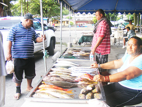 A woman selling fish at the Fagatogo Marketplace in 2016