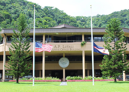 U.S. and American Samoa flags outside the ASG Executive Office Building