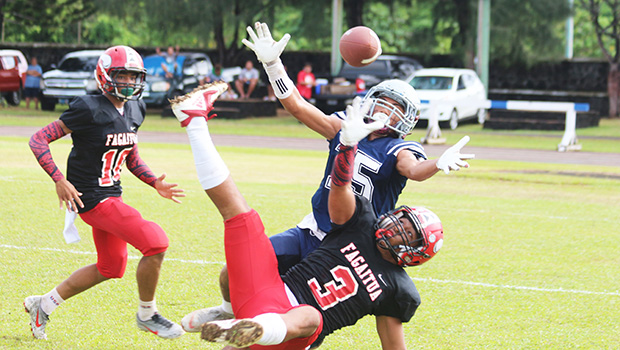 Samoana Sharks Allen Seagai (15) concentrates on trying to catch this long pass from Viliamu Tanielu,