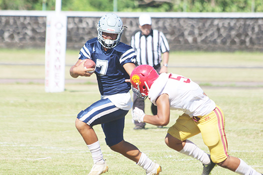 Viliamu Tanielu of the Sharks trying to evade a Tafuna defender