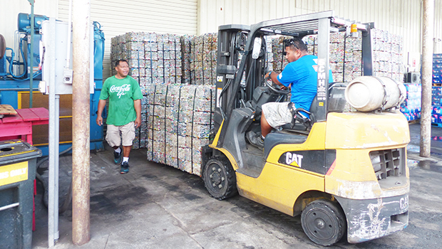 GHC Reid employees working with cans for recyling