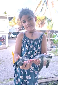Ilissapesi Sakalia holding her turtles 