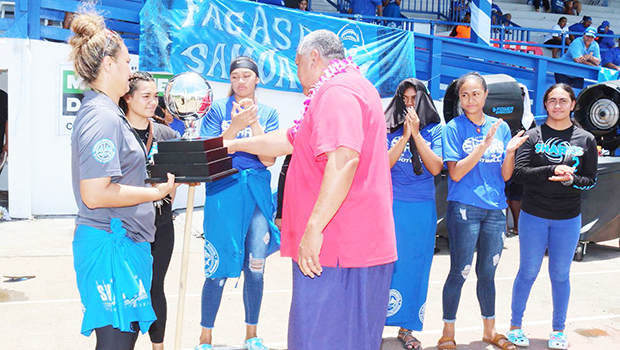 Gov pesents Volleyball trothy to Samoana girls coach