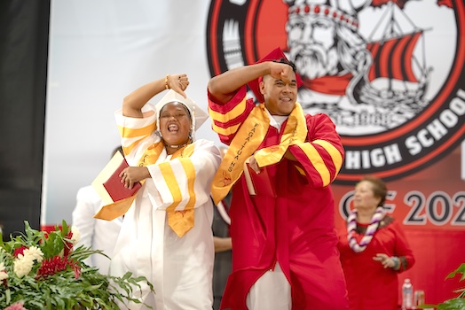 Two graduates celebrating