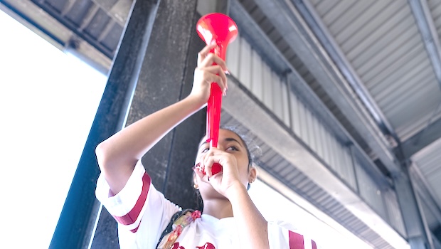 Nu'uuli VocTech graduate blowing horn