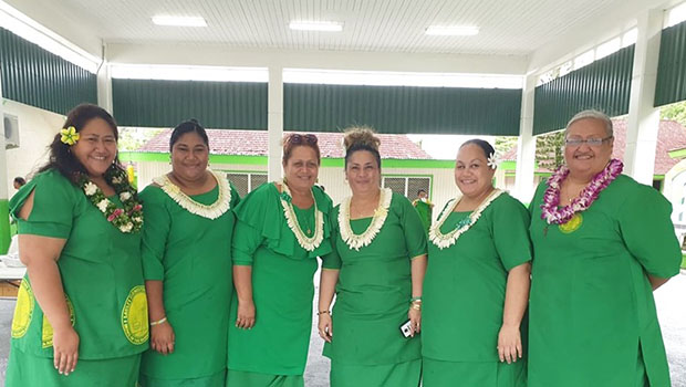 Teachers and principal pictured inside new gym
