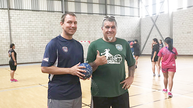 American Samoa Handball Association (ASHA) president and head coach Carl Floor Sr., and ASBA coach Michael Marsik with American Samoa’s U20 Women’s Handball Team practicing in the background