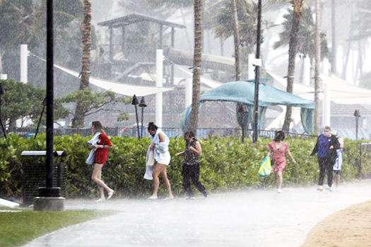 People running through the rain