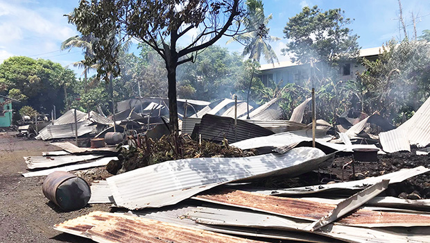 roofing iron smoldering and spread around on the ground