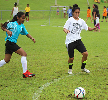 A Tafuna Jets player (left) and Ilaoa & To’omata opponent in action  