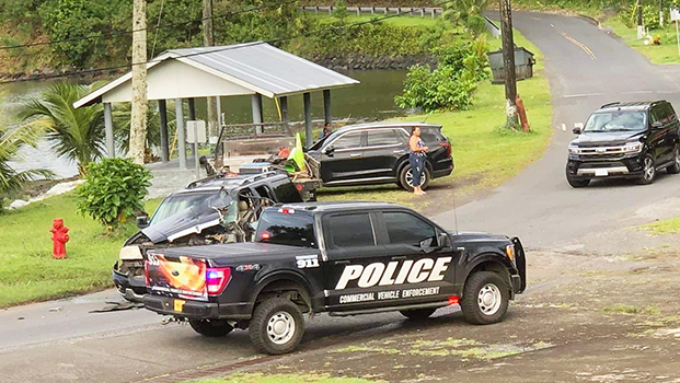 Wrecked truck involved in traffic accident with police cars